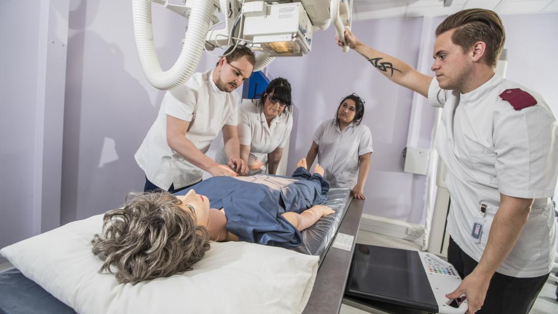 Students training to use an x-ray machine