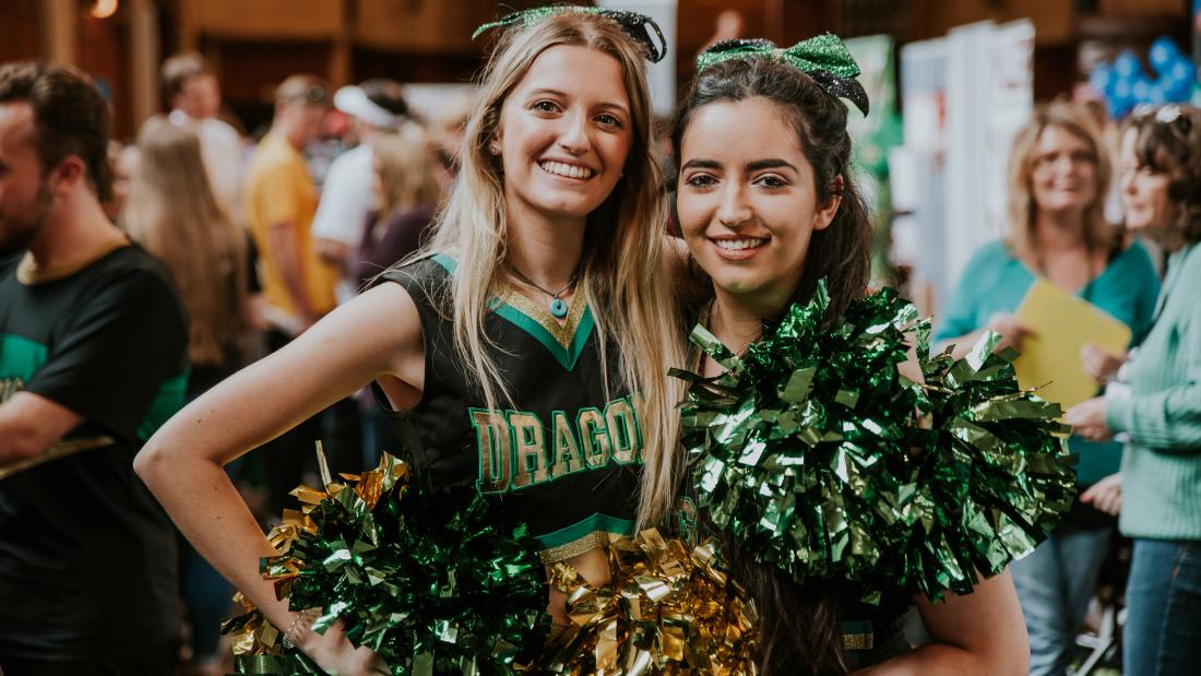 Two cheerleaders at the Serendipity Fair during Welcome Week