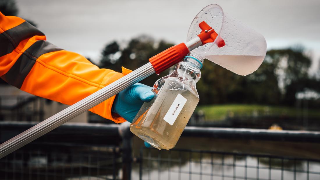 Arm holding waste water sample