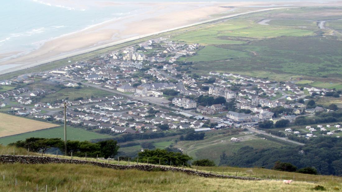 A small seaside community is seen from above.