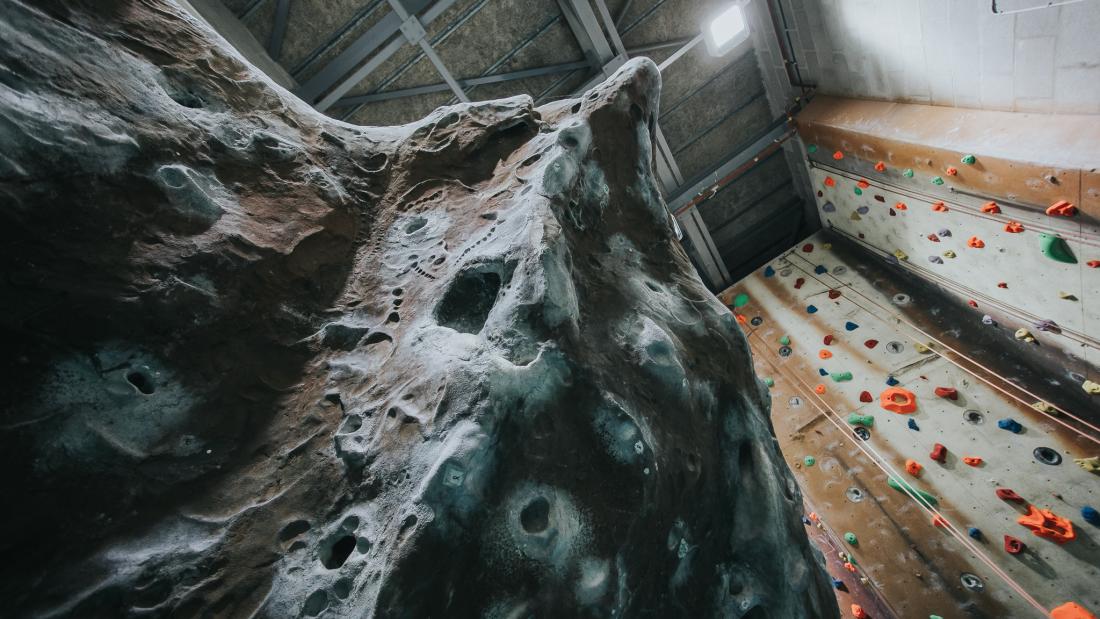  a bouldering wall and section of the climbing wall
