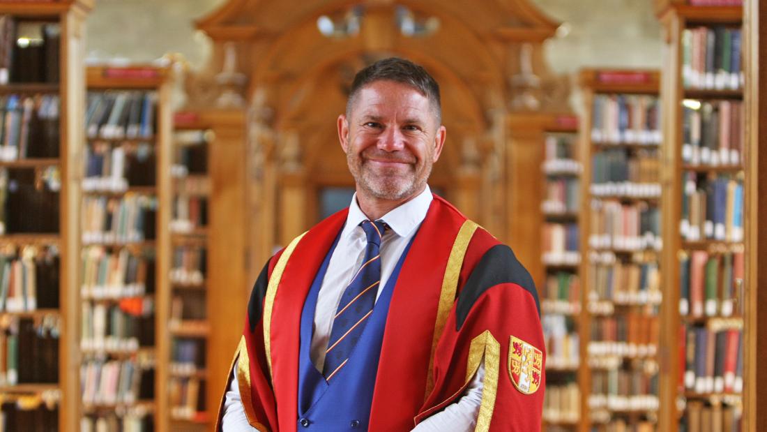 Steve Backshall in Bangor University Library in graduation gown