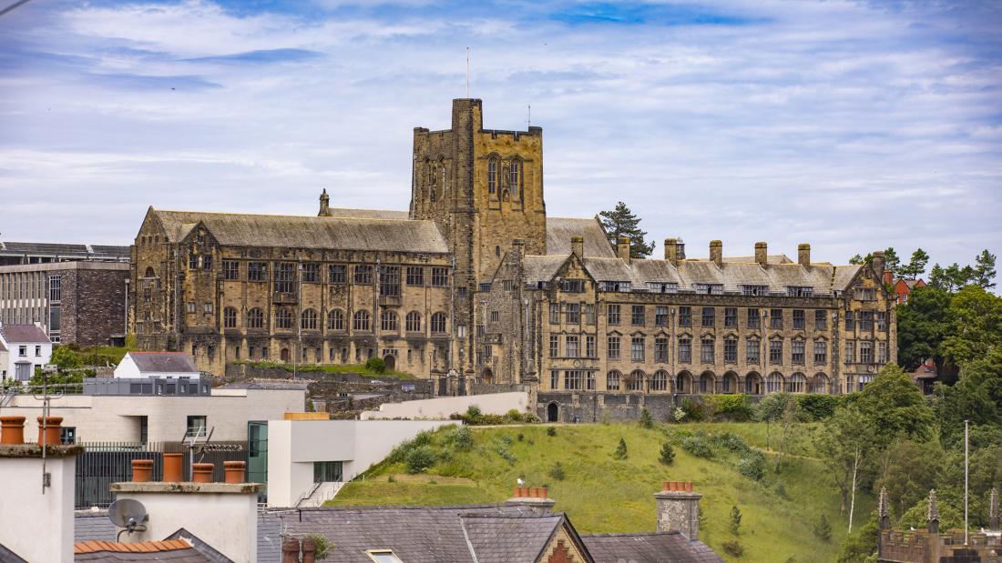 Main University Building with rooftops in foreground