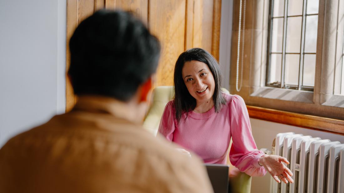 A student meeting and chatting with their Personal Tutor