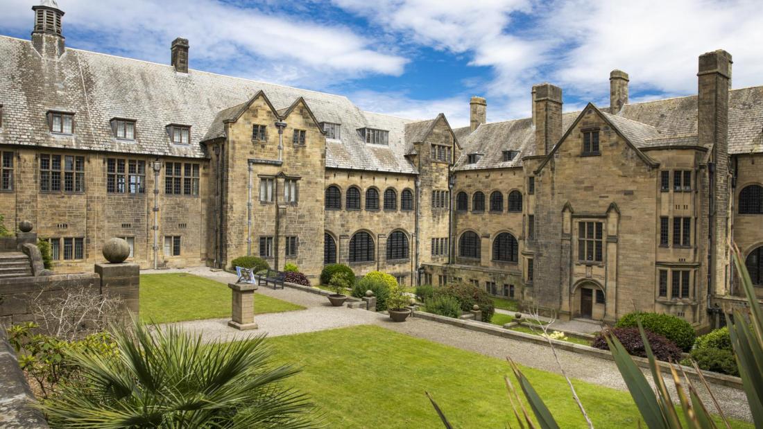 Bangor University's inner quad with blue sky and white clouds