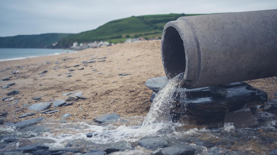 A large sewage pipe on the beach