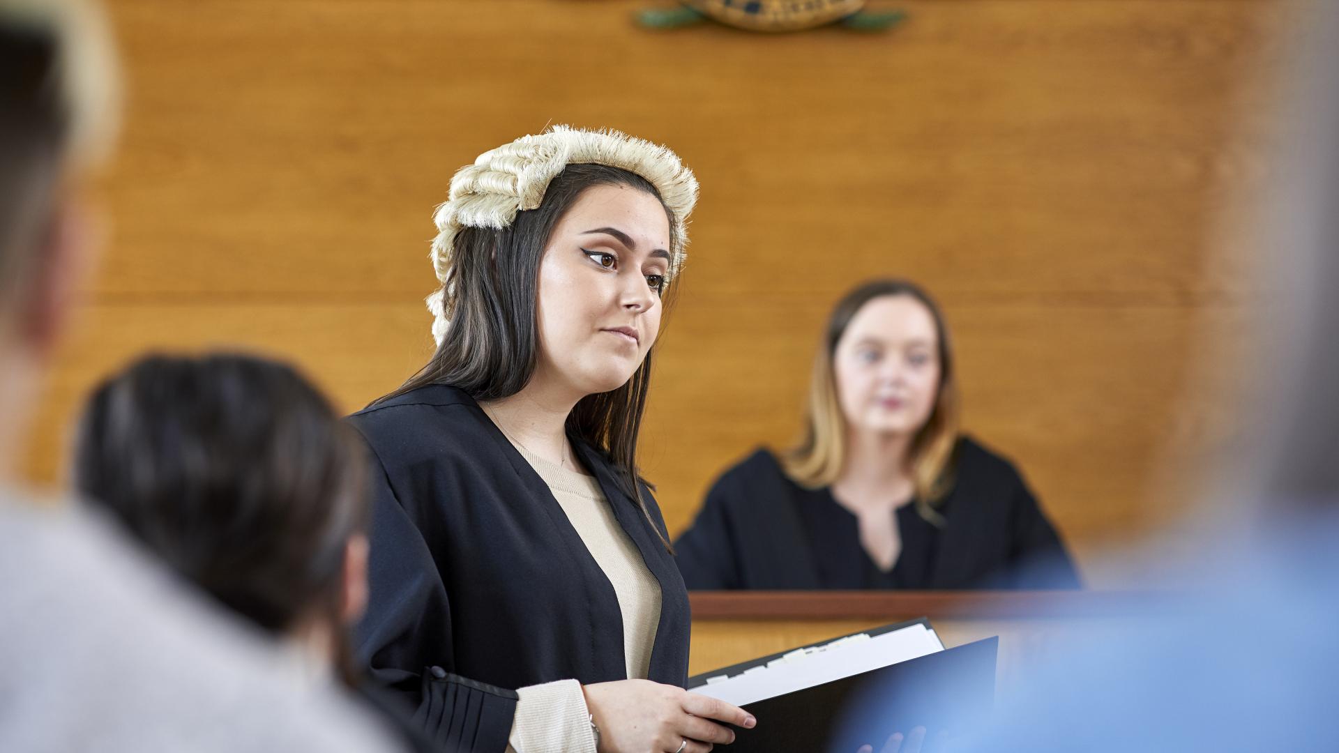 Students mooting in mock courtroom
