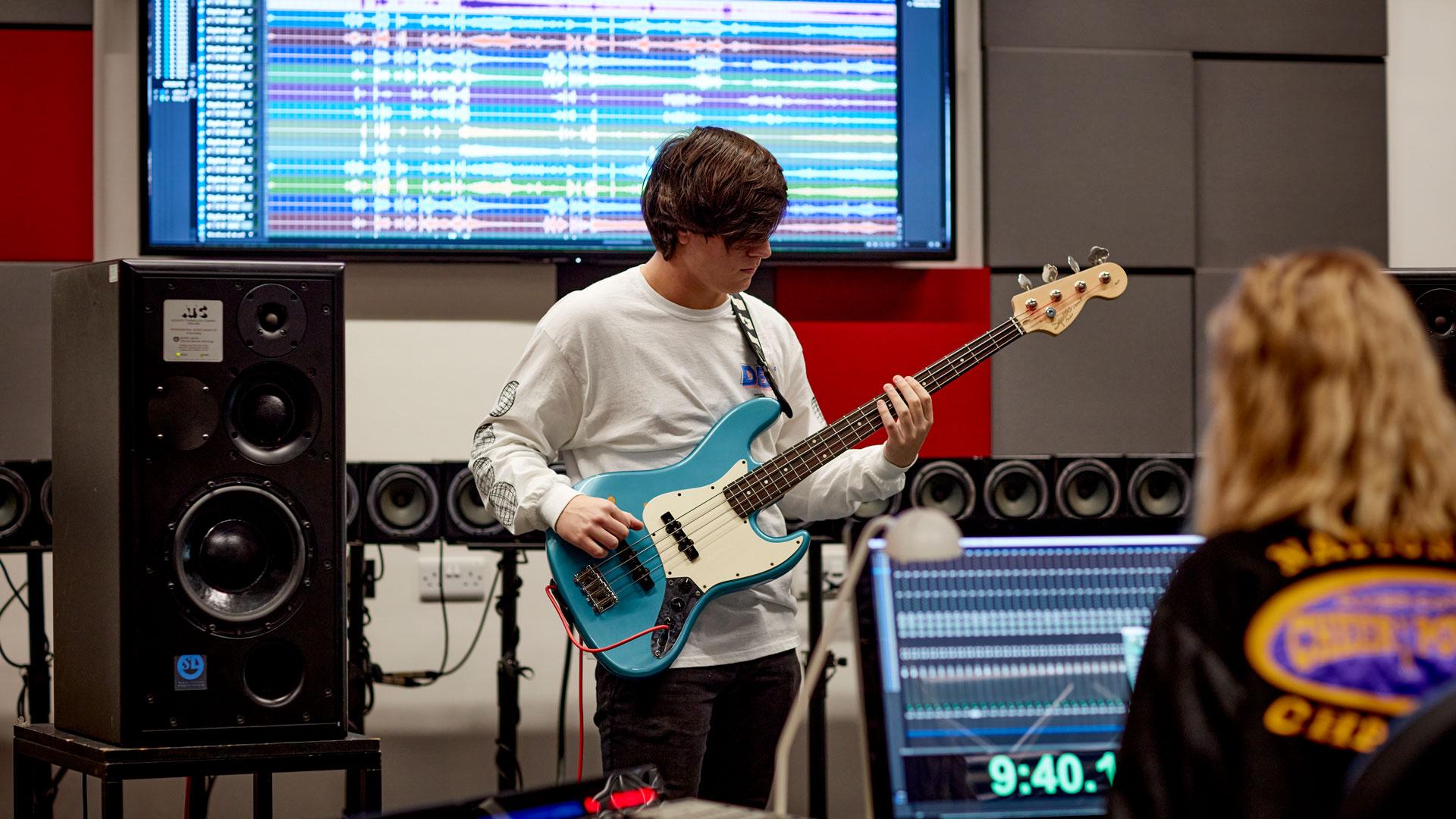 Student recording the Bass Guitar