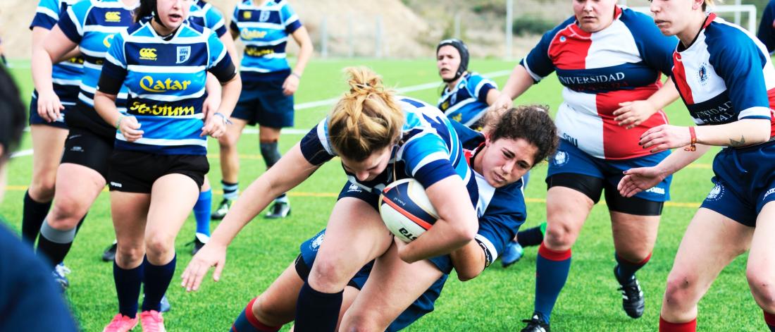 Female Rugby Players on the field.