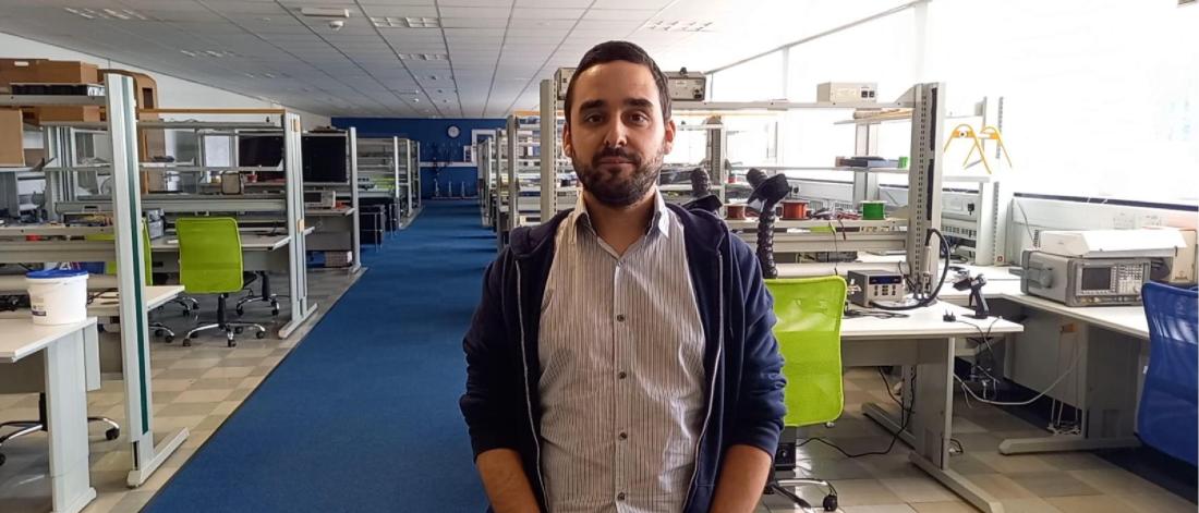 Daniel Roberts standing in the electronic engineering laboratory