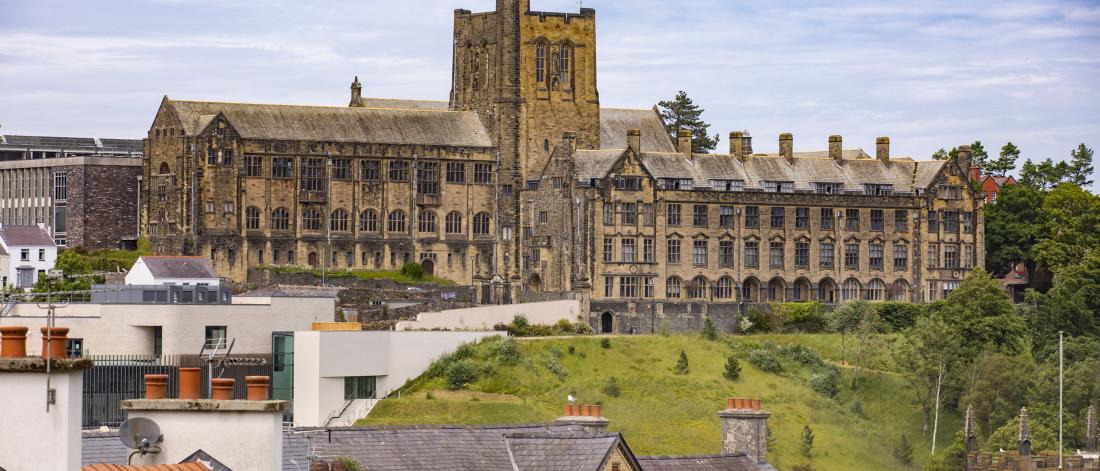 Main University Building with rooftops in foreground