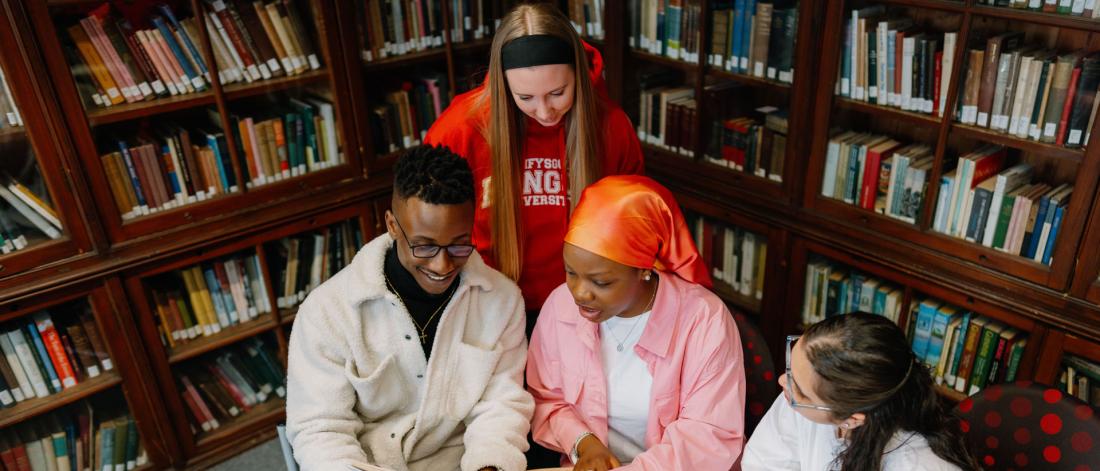 students studying history books in library