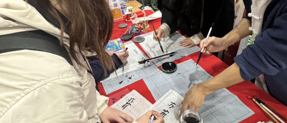 Students trying calligraphy