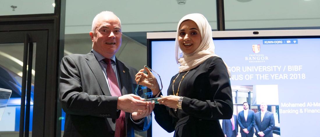 Prof. Andrew Edwards presenting an award to Duaa AlMasqati