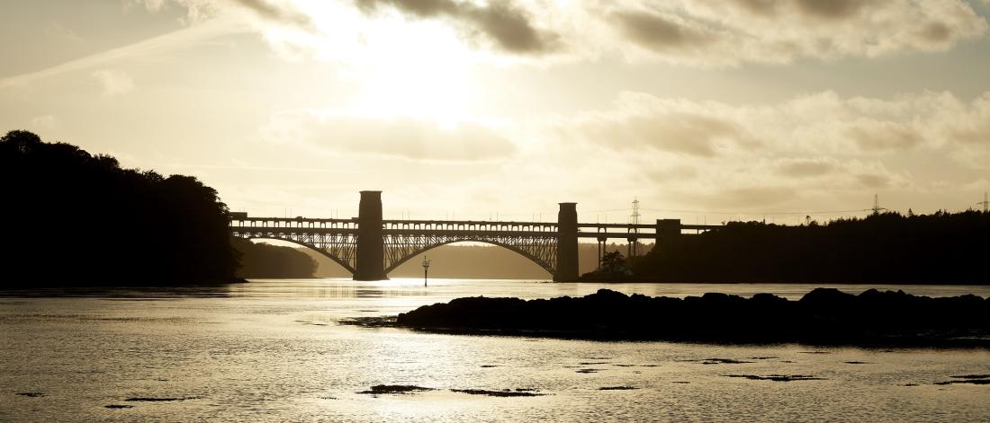 image of Britania Bridge with a sunset in the distance