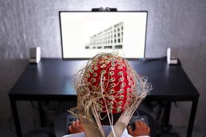 Students wearing headpiece in Psychology experiment