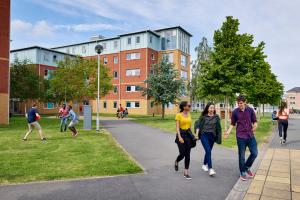 Students walking through Ffriddoedd Student Accommodation