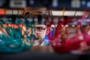 Student working with wires in a Computer Science and Electronic Engineering Lab