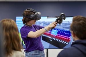 Students working with a Virtual Reality headset