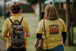 A couple of Peer Guides walking through Ffriddoedd Student Village during Welcome Week