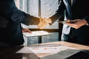 Two business professionals shaking hands