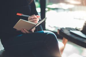 Woman writing in journal