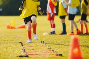 Young athletes training on grass