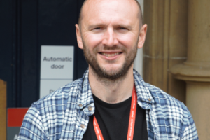 Kevin Williams standing in front of Bangor University building