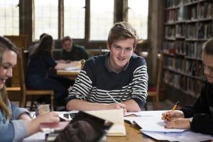 Group of students studying in library