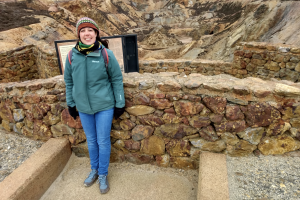 Katie Devenish standing in front of an excavation area