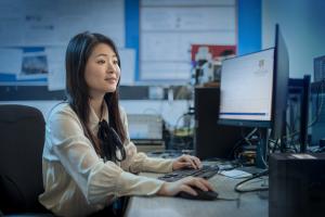 woman sitting at computer desk