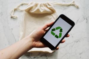 Image of a tote bag and phone - symbolic of sustainability