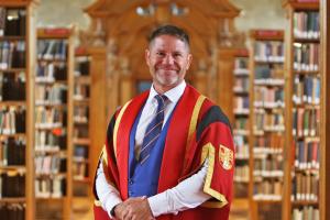 Steve Backshall in Bangor University Library in graduation gown