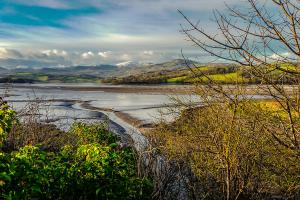 Conwy estuary with snow-capped mountains in the background