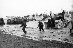 Commandos are seen here wading ashore from landing craft, onto the beaches of Normandy, June 1944. On 6 June 1944, around 4,300 Allied personnel lost their lives serving their country in what would be the largest amphibious invasion ever launched. This year marks the 70th anniversary of the Normandy Landings, centred around the date of invasion, 6 June, known as “D-Day”.