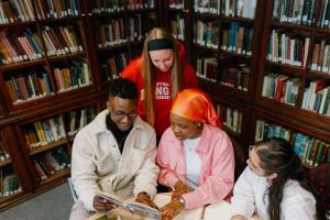 students studying history books in library