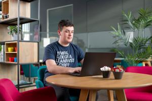 student wearing welsh t shirt