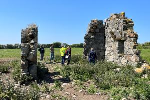 A group investigating a ruined building