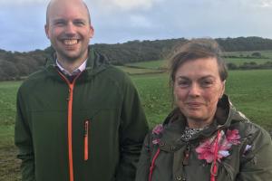 Two students stood side by side in the countryside