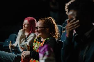 A group of students sitting down in the cinema in Pontio and watching a film