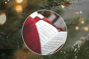 Picture of a musical score on a Christmassy background