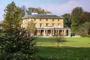 Photograph of Penpont, a Georgian house with a colonnade to its principal facade.