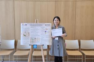 Jiaxiang at the TITAN project community event with her research poster on display