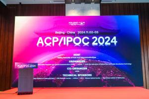 Photo of a large screen showing the 'ACP conference 2024'