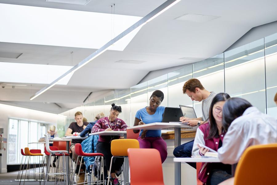 A group of students using the social learning spaces in Pontio