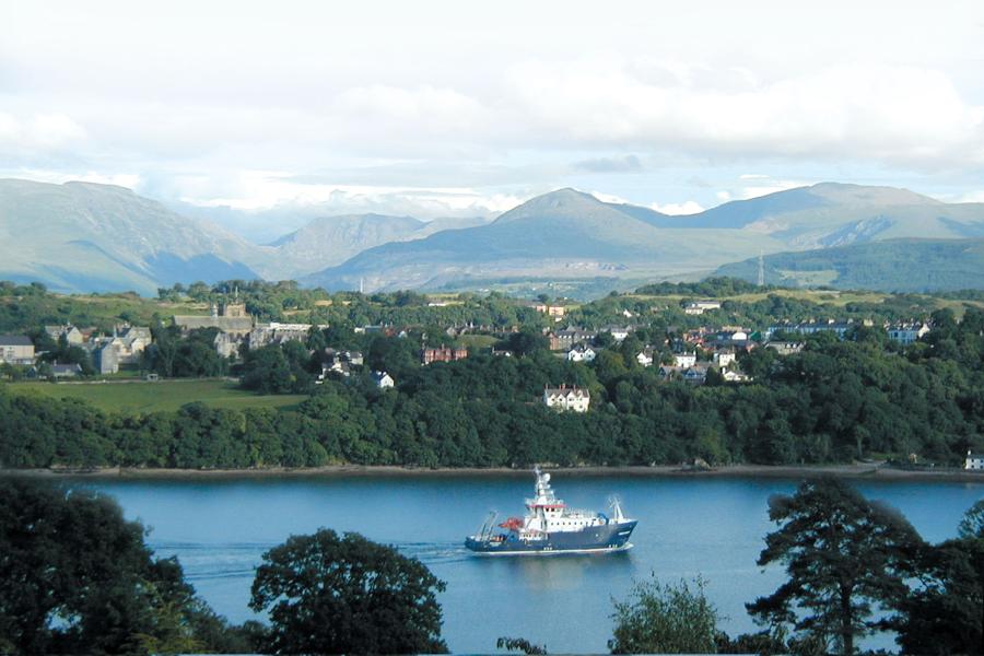 Bangor University's Prince Madog research vessel with Snowdonia mountains in the background