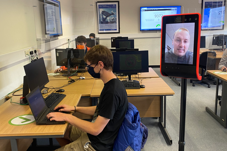 Person at desk with telerobot