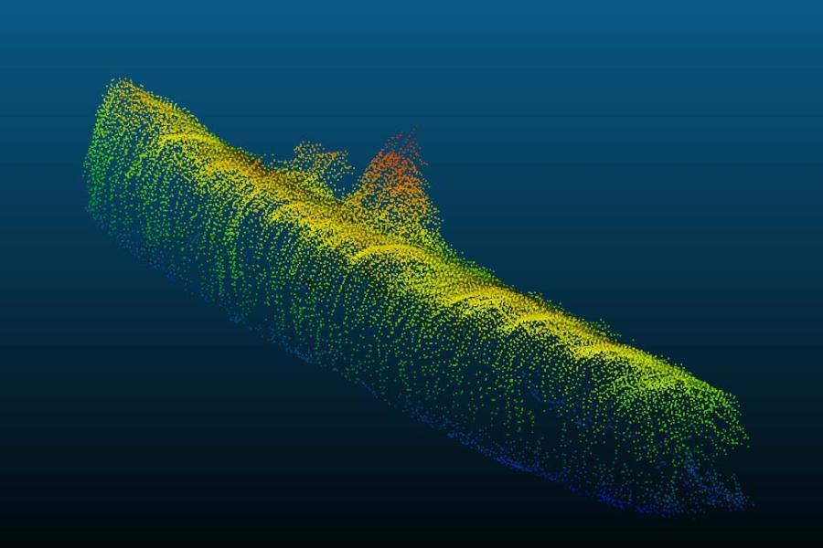 A yellow sonar image of a U boat againts a blue background