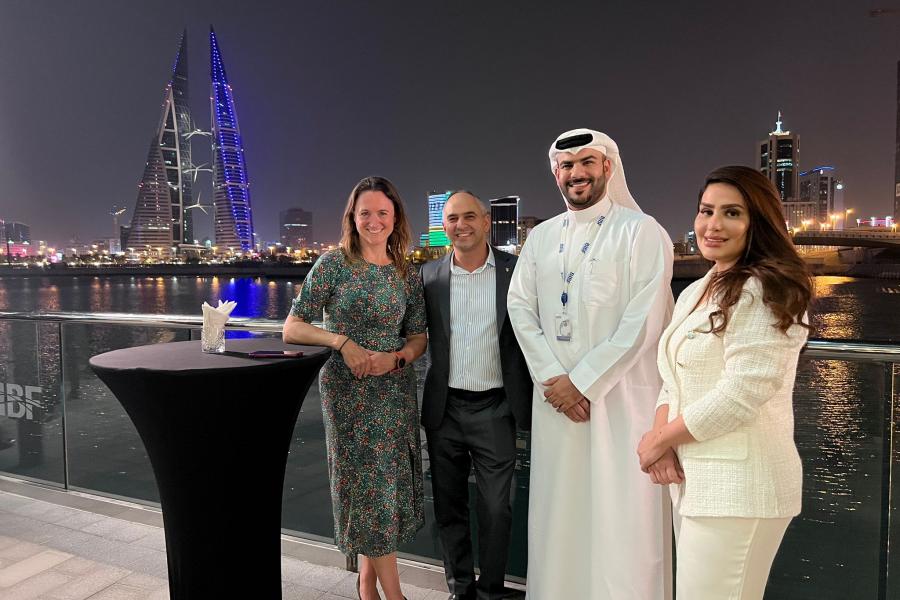 Four guests smiling at the camera during Bahrain reunion 2022