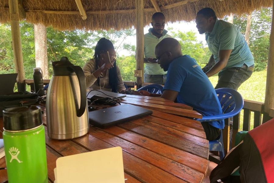 a group of people discussing outside 